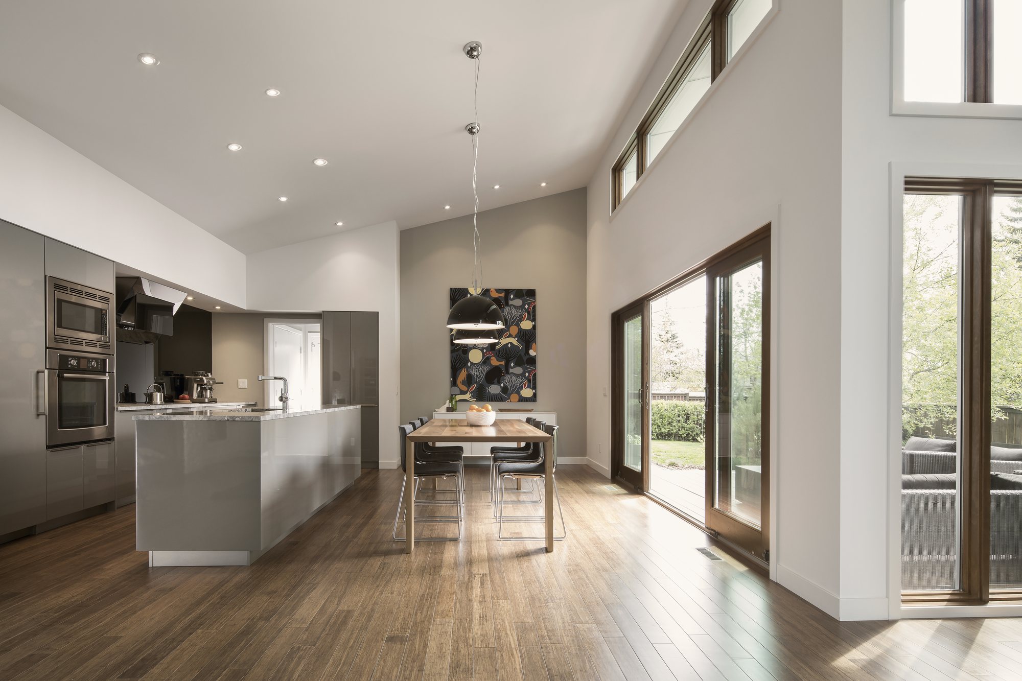 Open-plan kitchen and dining under a vaulted ceiling