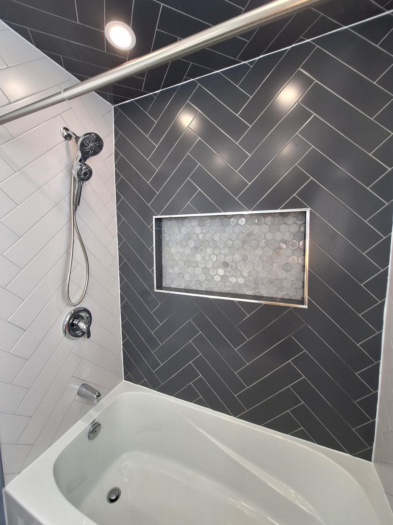 Charcoal herringbone - Custom niche · Tub surround